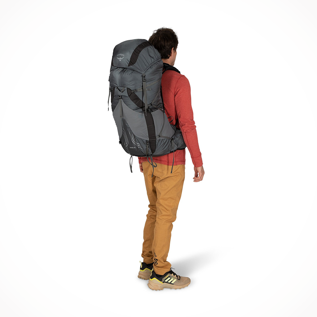 Product image: Camping Backpacks Womens Osprey Exos 48 Tungsten Grey Model Rear, side profile view.