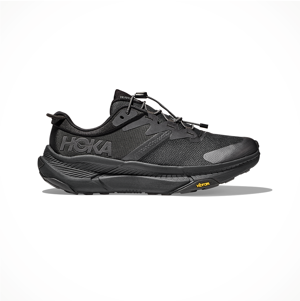 Product image: Footwear Hoka Mens Transport Black Black, side profile view.