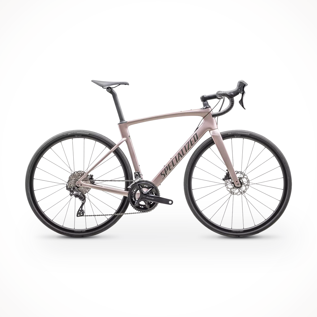 Product image: Specialized ROUBAIX SPORT 105 CHAM SMK, shown in primary marketing view.