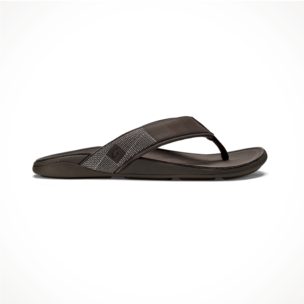 Product image: Footwear Olukai Mens Tuahine Dark Wood, side profile view.