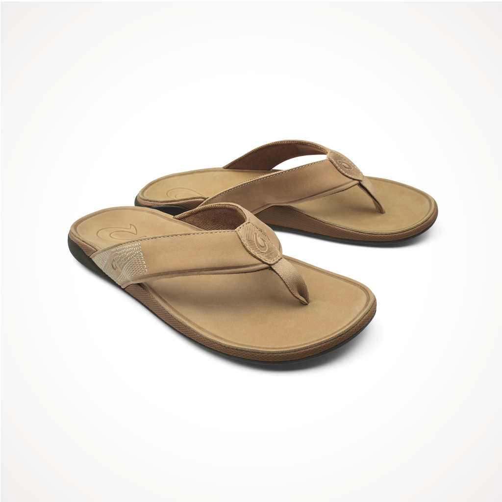 Product image: Footwear Olukai Mens Tuahine Golden Sand, shown from a three-quarter angled view.