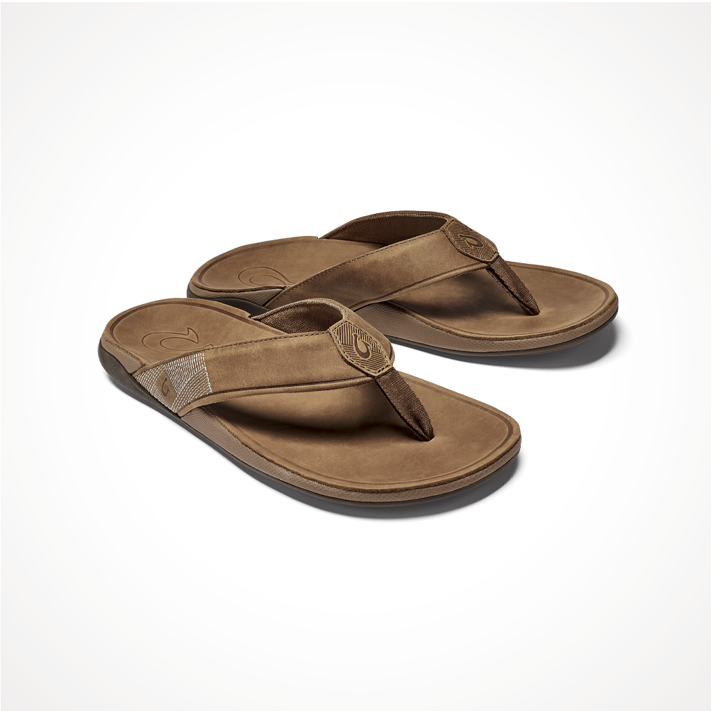 Product image: Footwear Olukai Mens Tuahine Toffee, shown from a three-quarter angled view.
