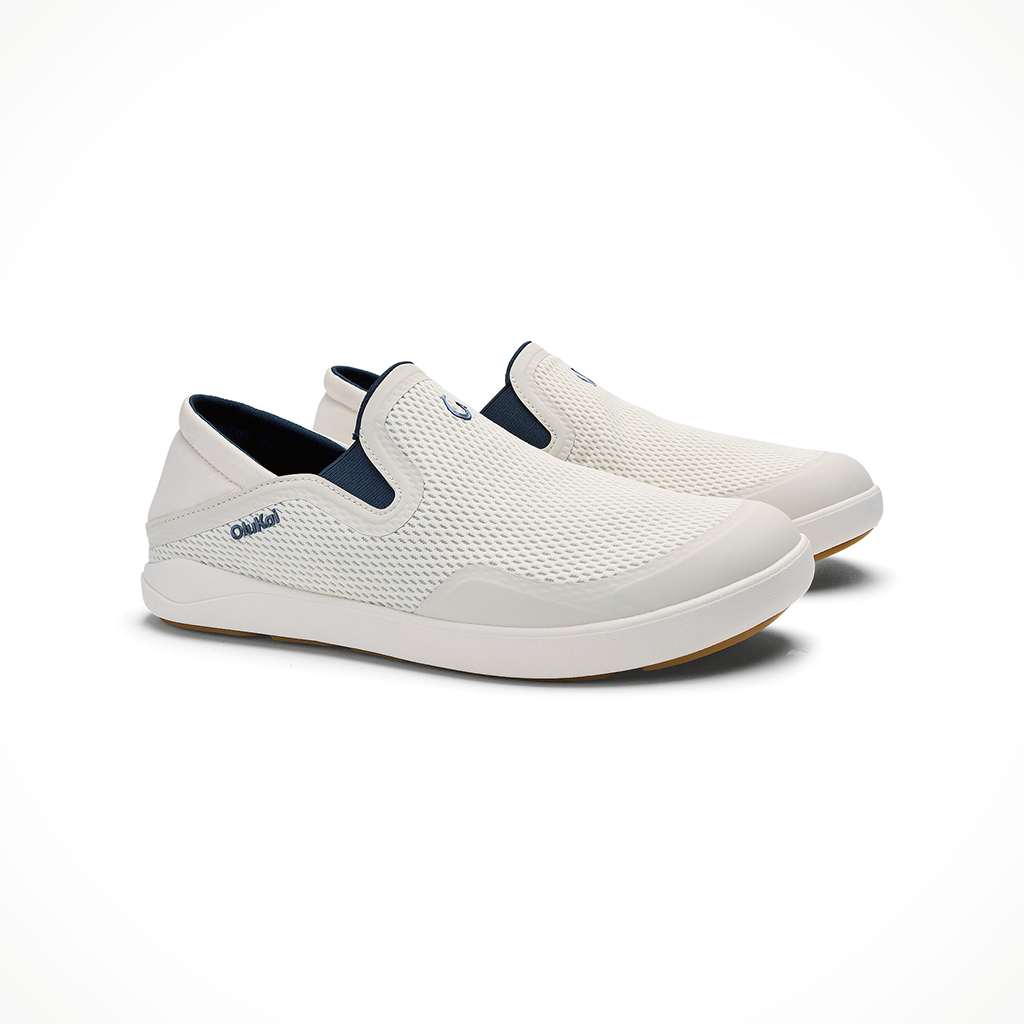Product image: Olukai Moku Slip On White Sand Trench Blue Mens 2026, shown as a pair.