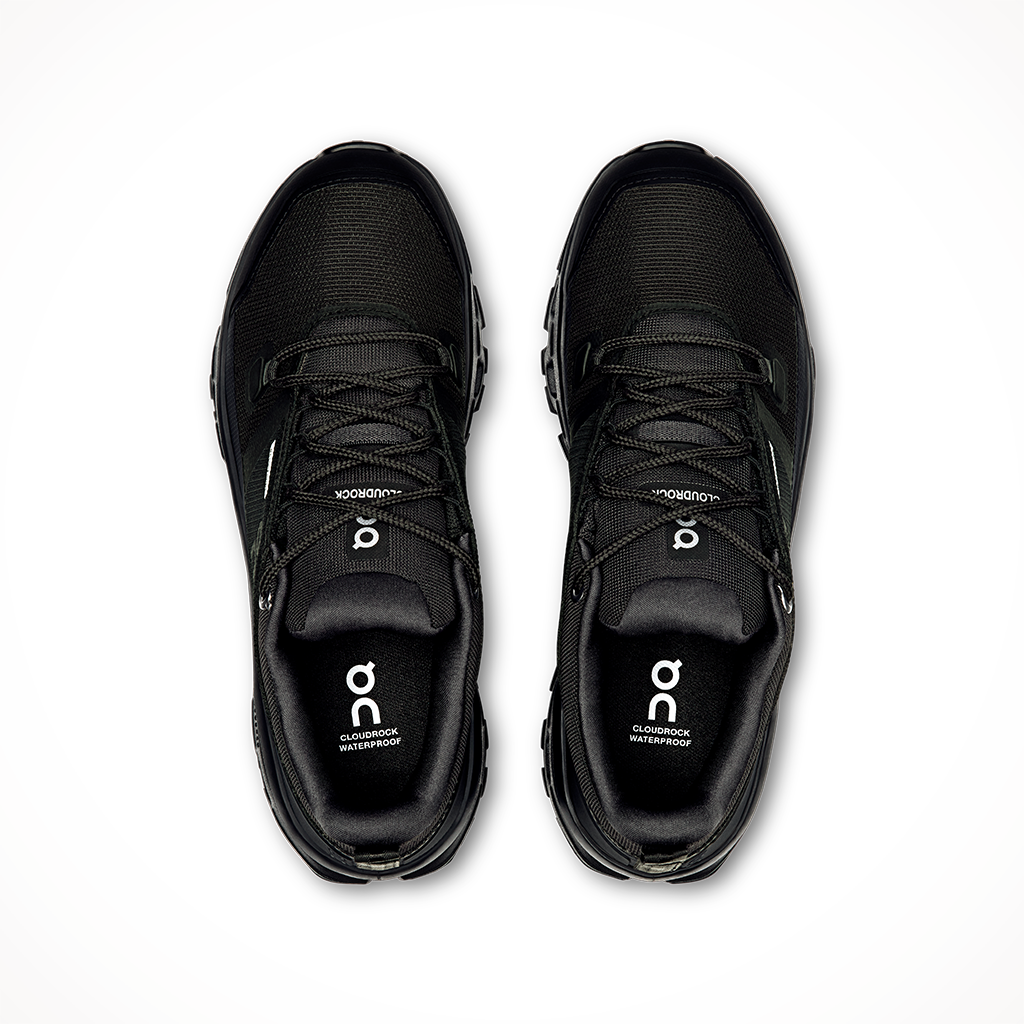 Product image: On Cloudrock Low Black Black Wo Mens 2025, shown from above.