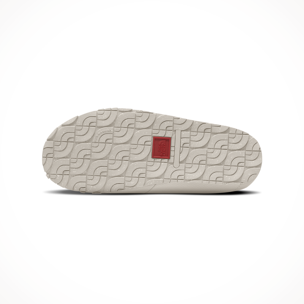 Product image: TNF Thermoball Traction Mule V Gardenia White Silver Grey Womens 2025, showing the bottom view.