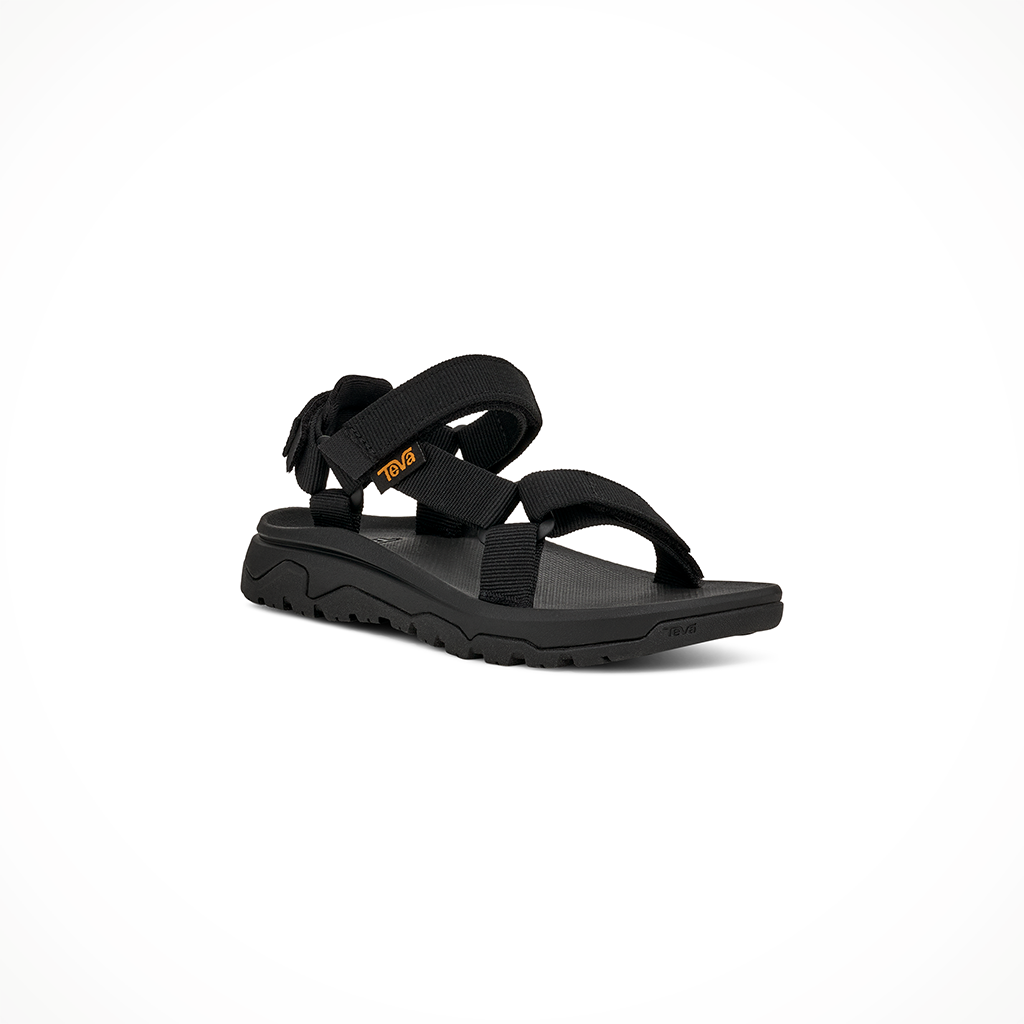 Product image: Teva Hurricane XLT JR Black Kids 2026, shown from a three-quarter angled view.