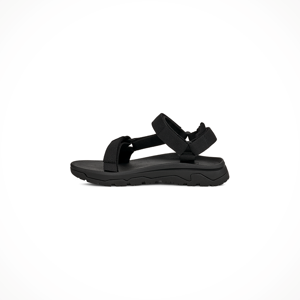 Product image: Teva Hurricane XLT JR Black Kids 2026, shown from the left side profile.